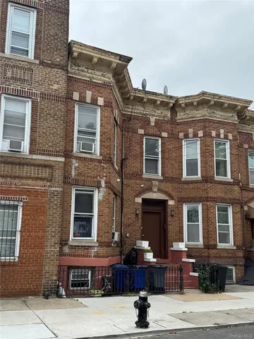a front view of a building with many windows