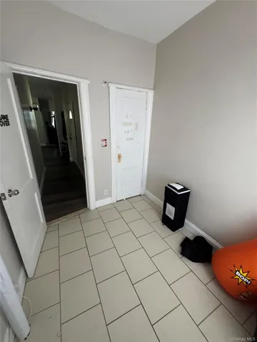 a view of an empty room and hallway