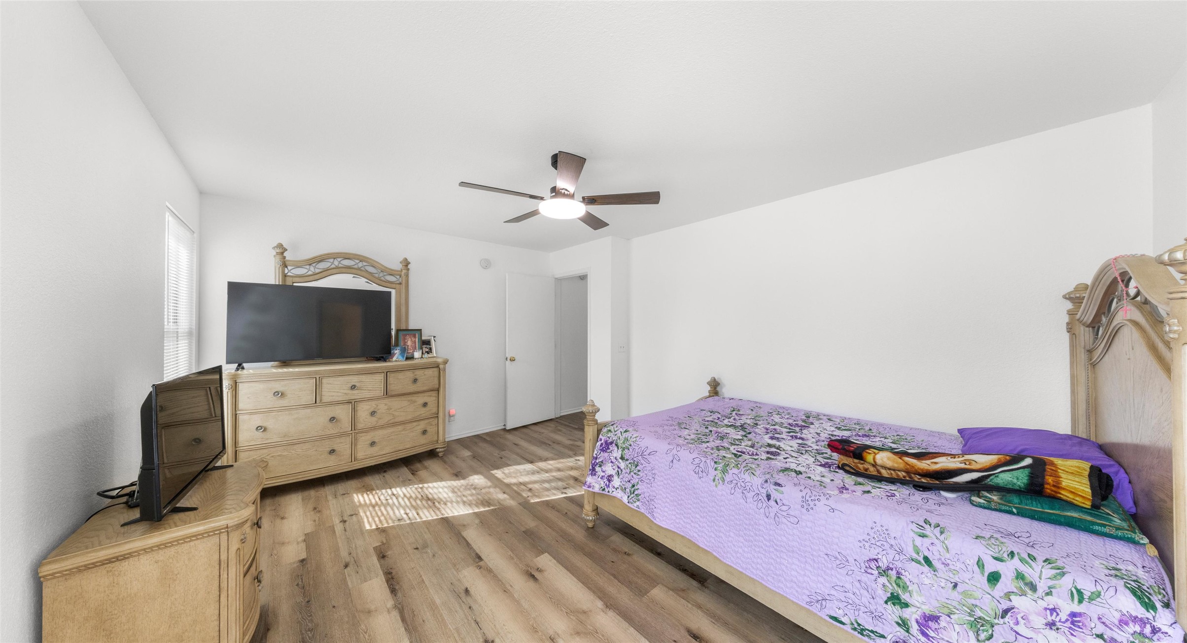 248 Endeavour Kyle, TX 78640 - Photo 13 of 32 Bedroom featuring wood finished floors and ceiling fan