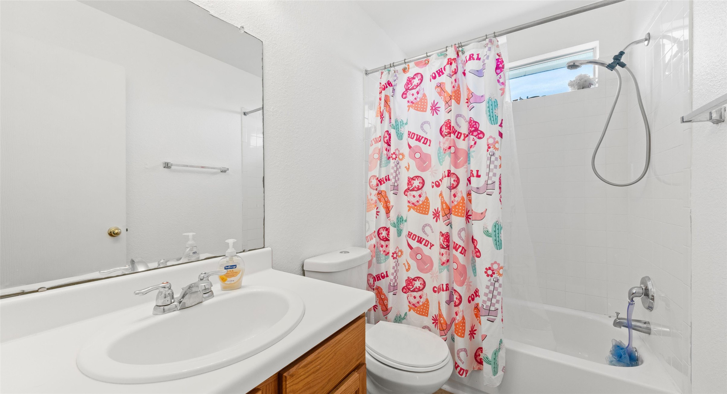 248 Endeavour Kyle, TX 78640 - Photo 17 of 32 Full bathroom featuring vanity and shower / tub combo with curtain