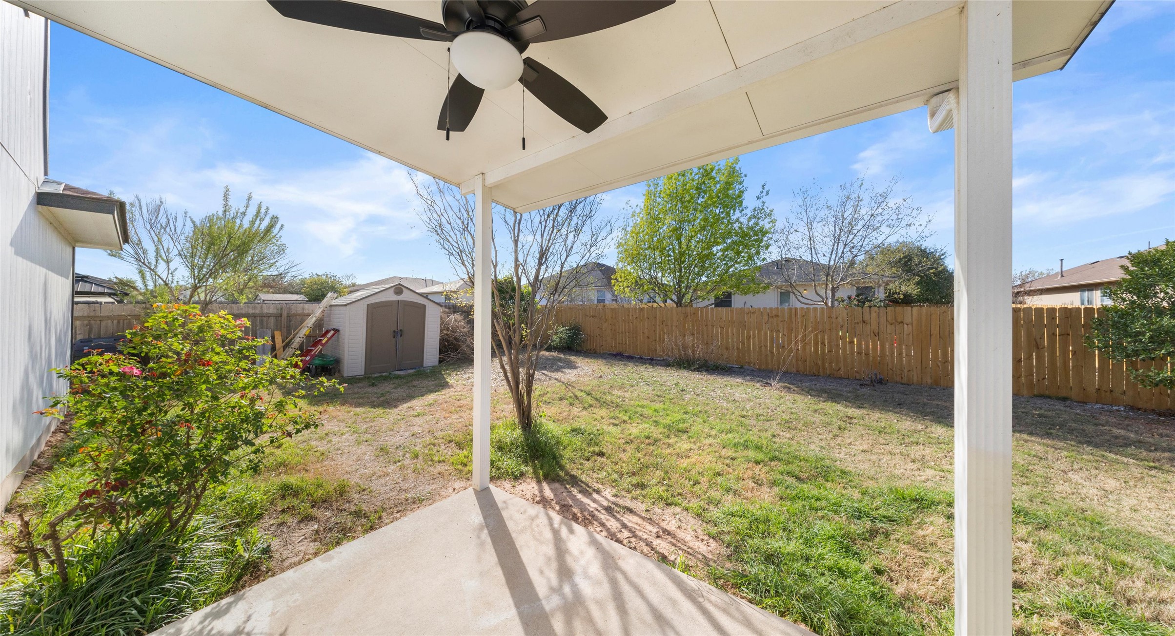 248 Endeavour Kyle, TX 78640 - Photo 25 of 32 Fenced backyard featuring a patio, ceiling fan, and a storage shed