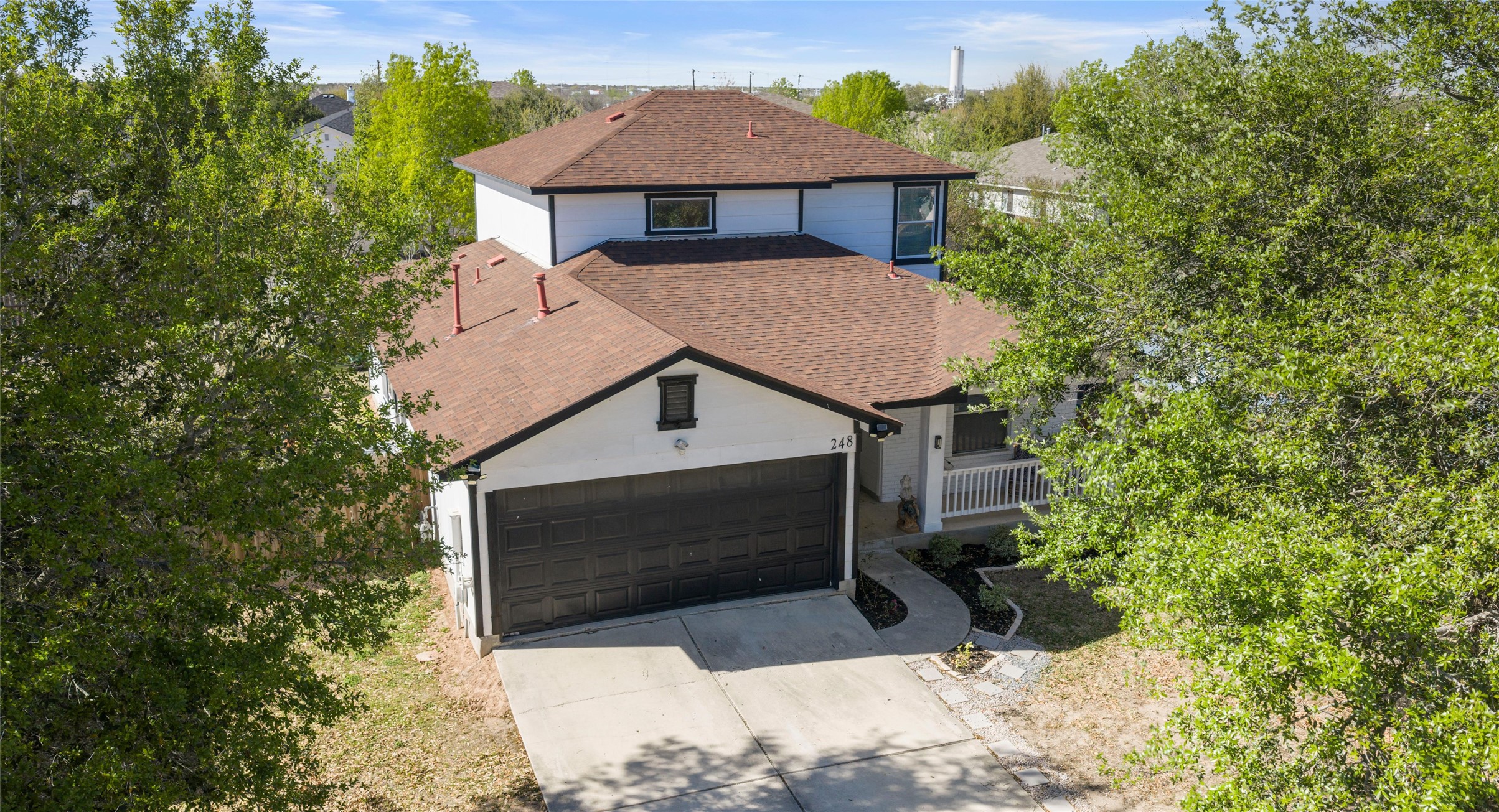 248 Endeavour Kyle, TX 78640 - Photo 31 of 32 View of front of home featuring concrete driveway, a garage, and roof with shingles