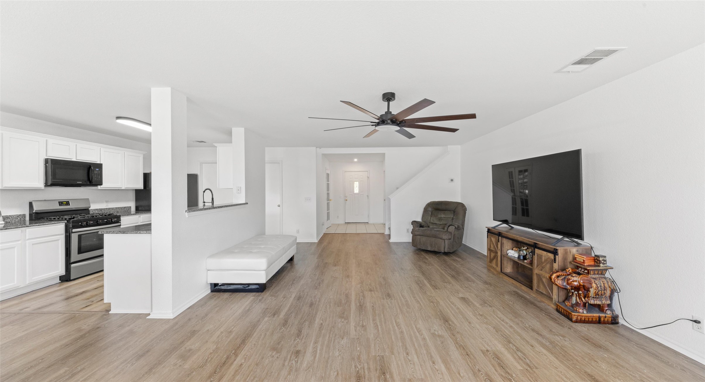 248 Endeavour Kyle, TX 78640 - Photo 10 of 32 Living area featuring light wood-type flooring and ceiling fan