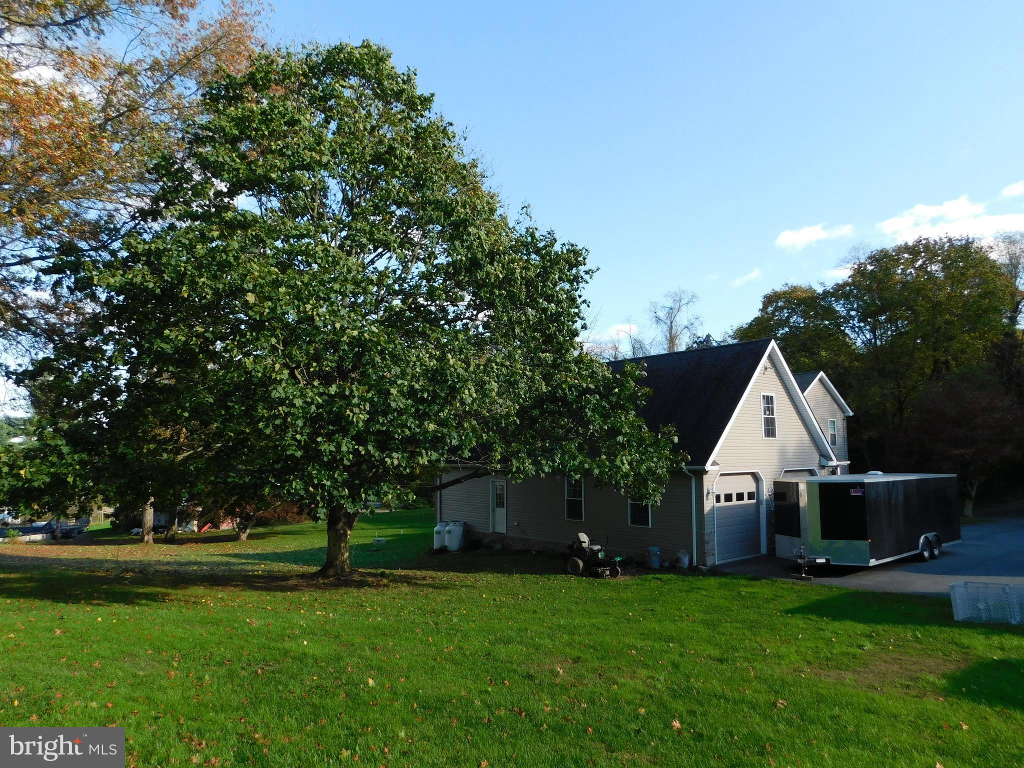 159 Miller Road Willow Street, PA 17584 - Photo 3 of 18 a front view of a house with a yard and trees