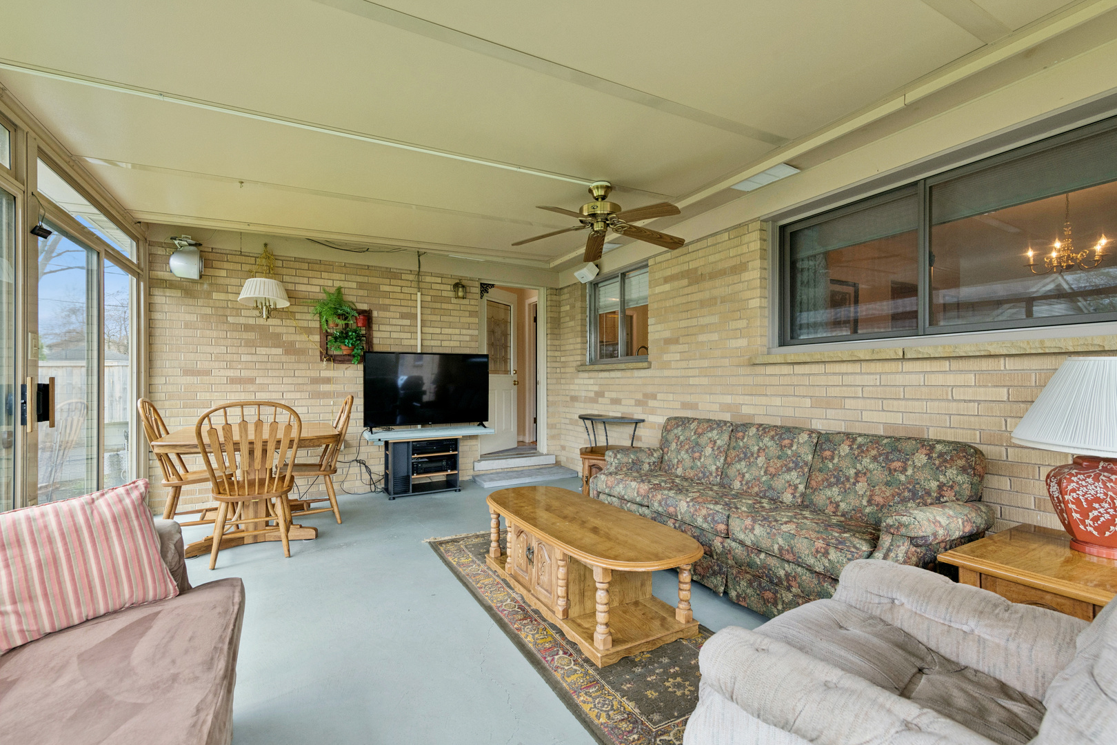 1715 Verde Court Mount Prospect, IL 60056 - Photo 14 of 30 a balcony with furniture and a flat screen tv