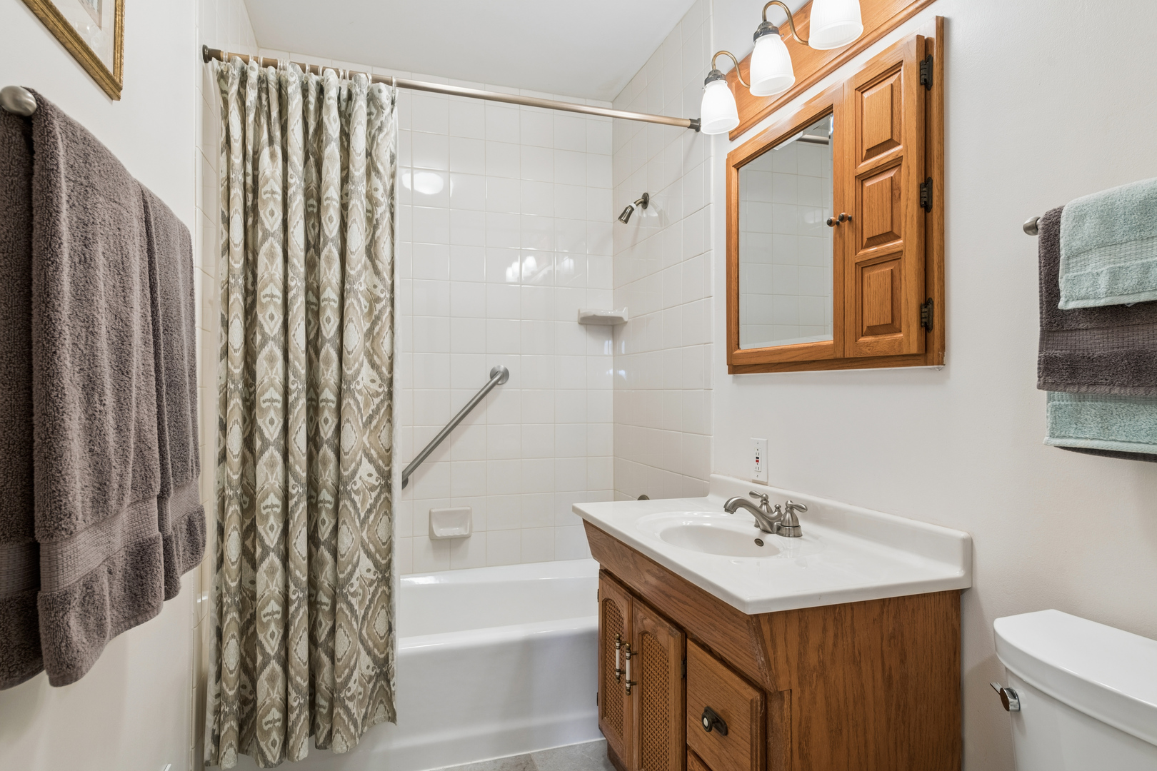 1715 Verde Court Mount Prospect, IL 60056 - Photo 18 of 30 a bathroom with a sink toilet and shower
