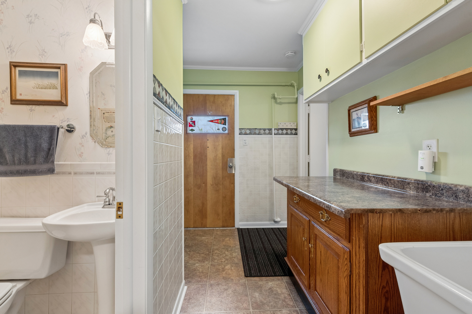 1715 Verde Court Mount Prospect, IL 60056 - Photo 21 of 30 a bathroom with a granite countertop sink a toilet and a shower