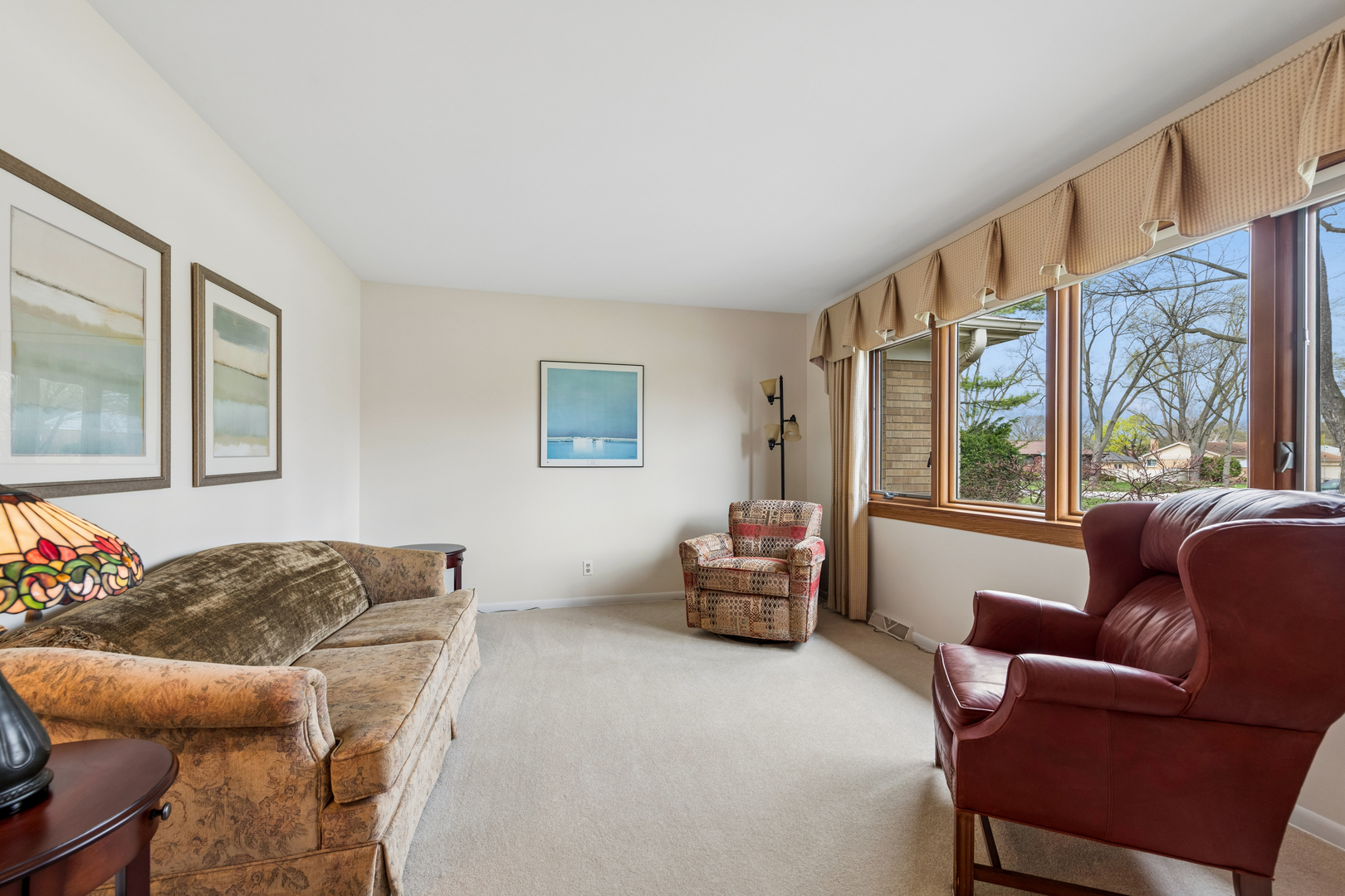 1715 Verde Court Mount Prospect, IL 60056 - Photo 6 of 30 a living room with furniture and a large window