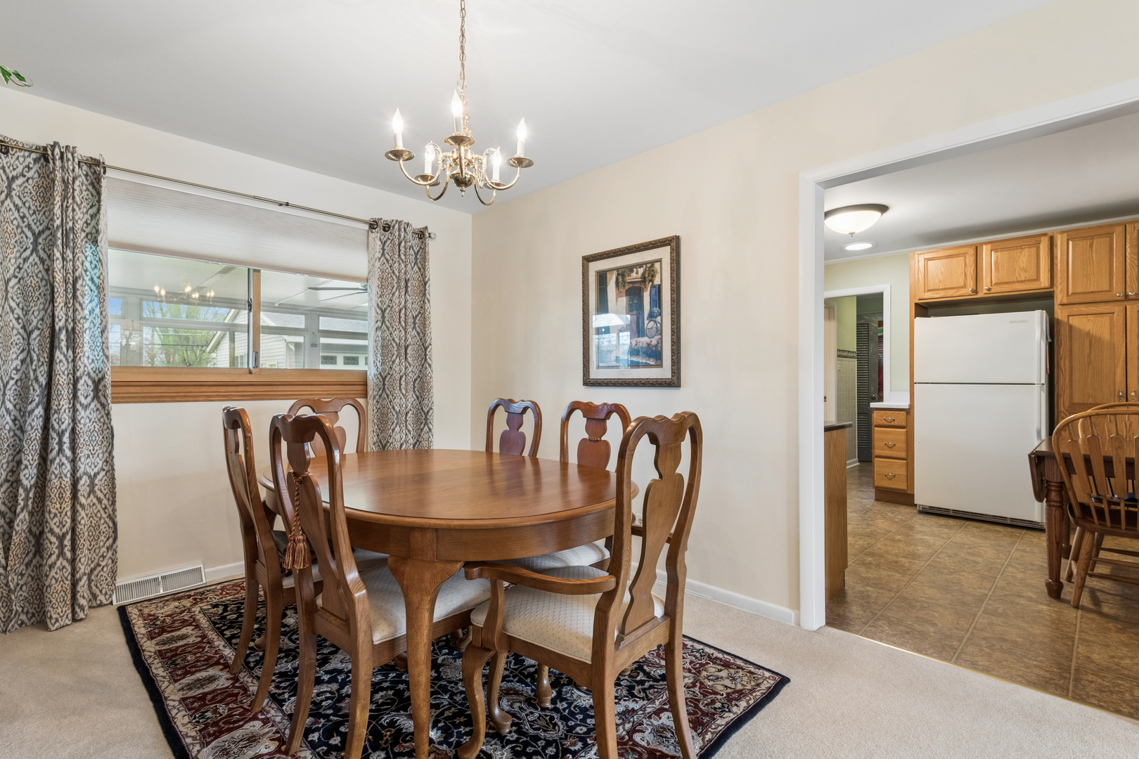 1715 Verde Court Mount Prospect, IL 60056 - Photo 7 of 30 a dining room with furniture a chandelier and wooden floor