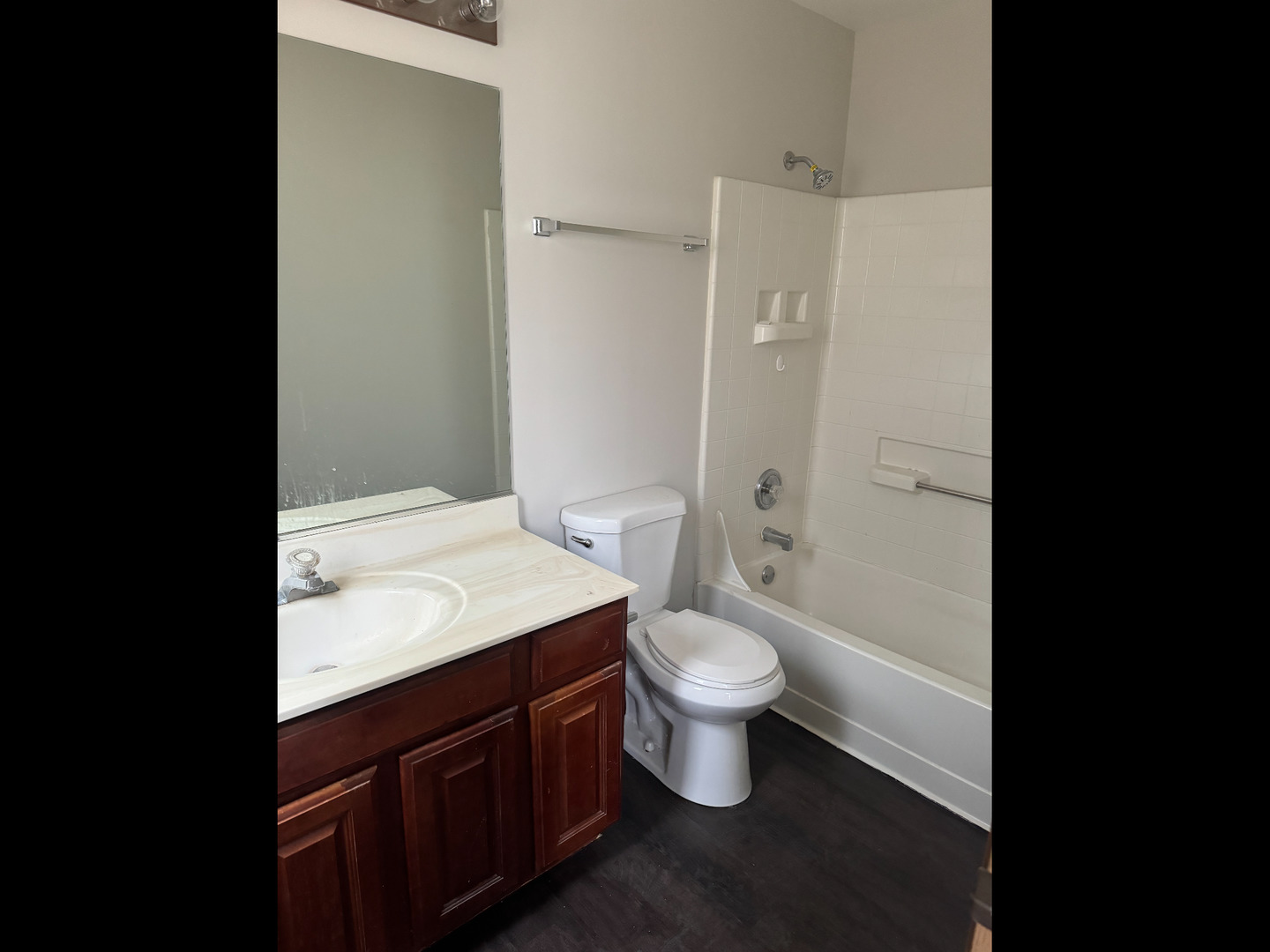 1009 Symphony Drive Aurora, IL 60504 - Photo 14 of 14 a bathroom with a sink a toilet and shower