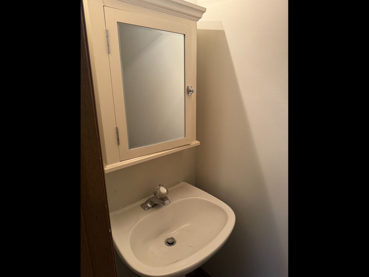 1009 Symphony Drive Aurora, IL 60504 - Photo 10 of 14 a bathroom with a sink and a mirror