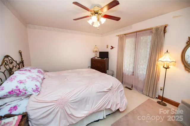 a bathroom with a sink vanity mirror and tub