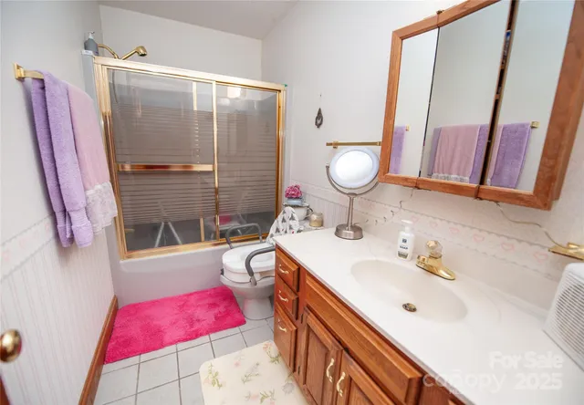 a bedroom with furniture and a flat tv screen