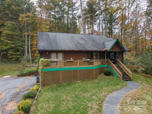 a view of house with outdoor space and sitting area