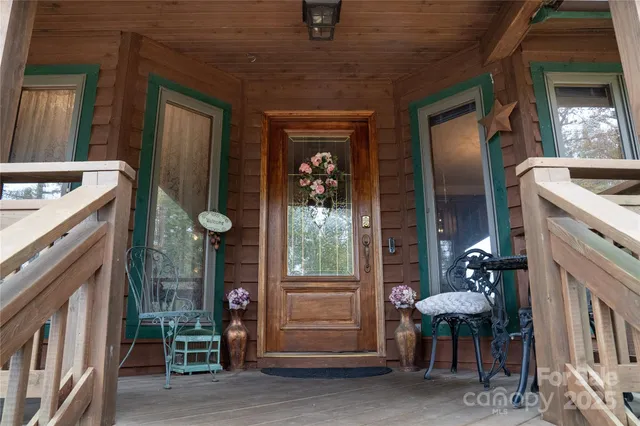 a view of living room kitchen and entryway