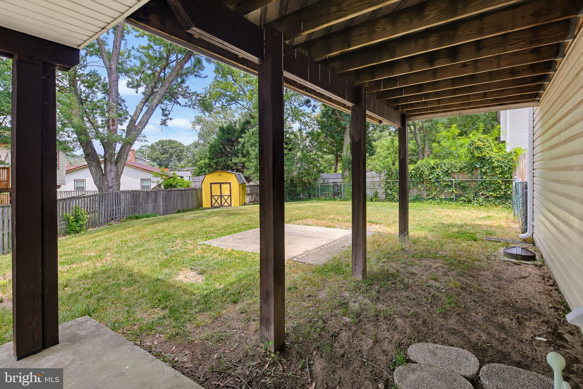 7802 Bastille Road Severn, MD 21144 - Photo 33 of 34 Spacious backyard with shaded patio.