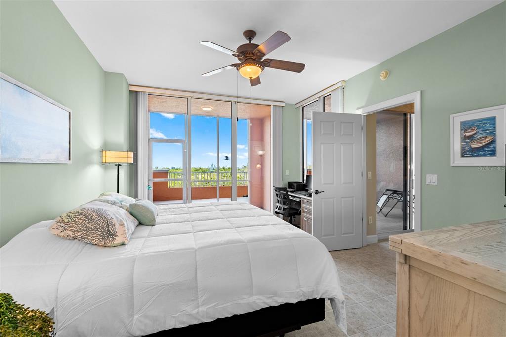 3191 Matecumbe Key Road, Unit 103 Punta Gorda, FL 33955 - Photo 15 of 48 a bedroom with a bed and a chandelier