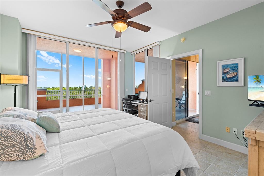 3191 Matecumbe Key Road, Unit 103 Punta Gorda, FL 33955 - Photo 16 of 48 a bedroom with a large bed and a large window