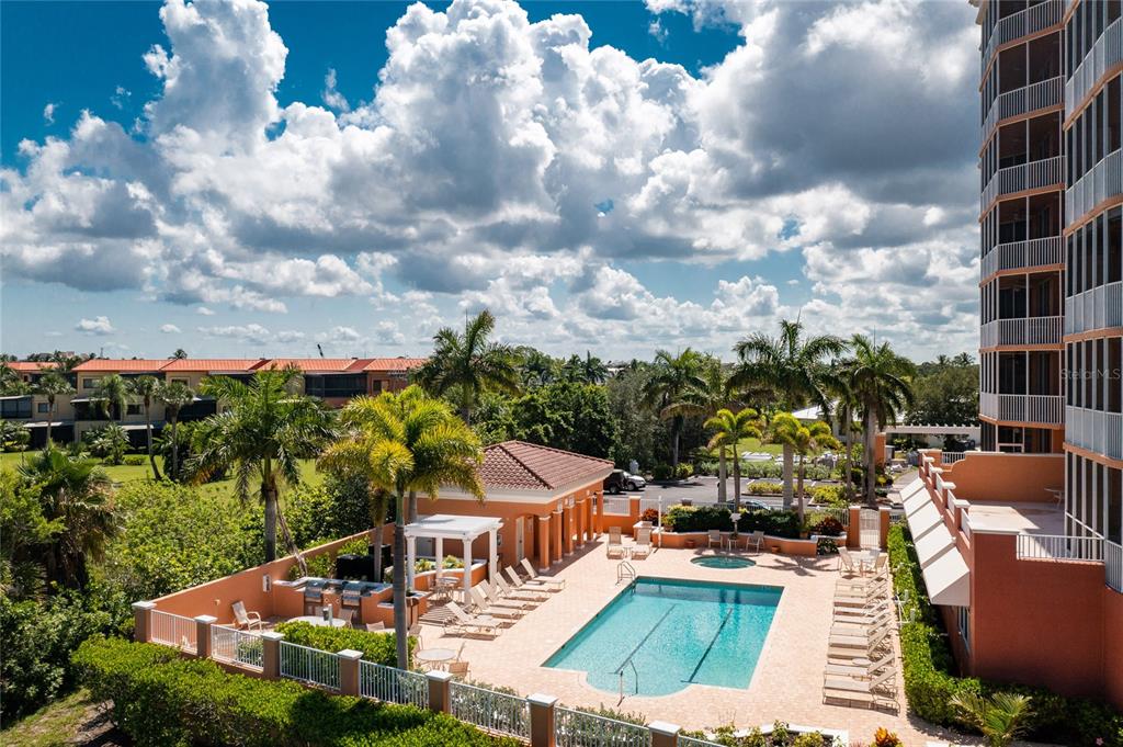 3191 Matecumbe Key Road, Unit 103 Punta Gorda, FL 33955 - Photo 3 of 48 an aerial view of a house with swimming pool and trees
