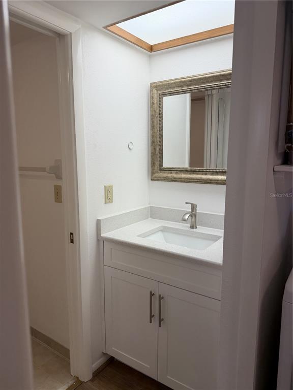 2004 Longpointe Circle Venice, FL 34293 - Photo 45 of 54 a bathroom with a granite countertop sink vanity and mirror