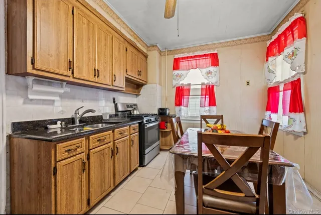 a view of a kitchen with appliances and furniture