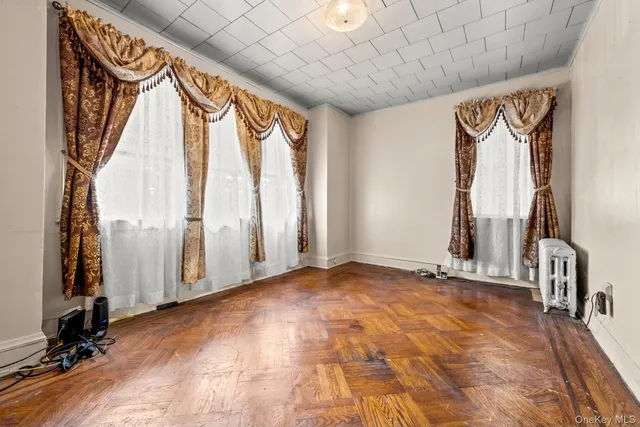 a view of an empty room with a fireplace