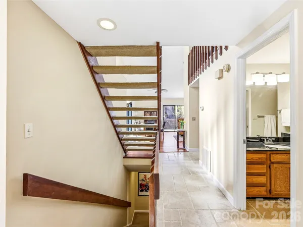 a view of entryway and hall with wooden floor