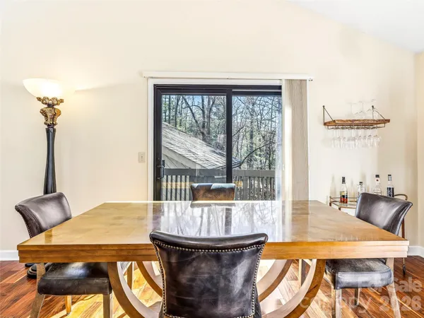 a balcony with a table and chairs