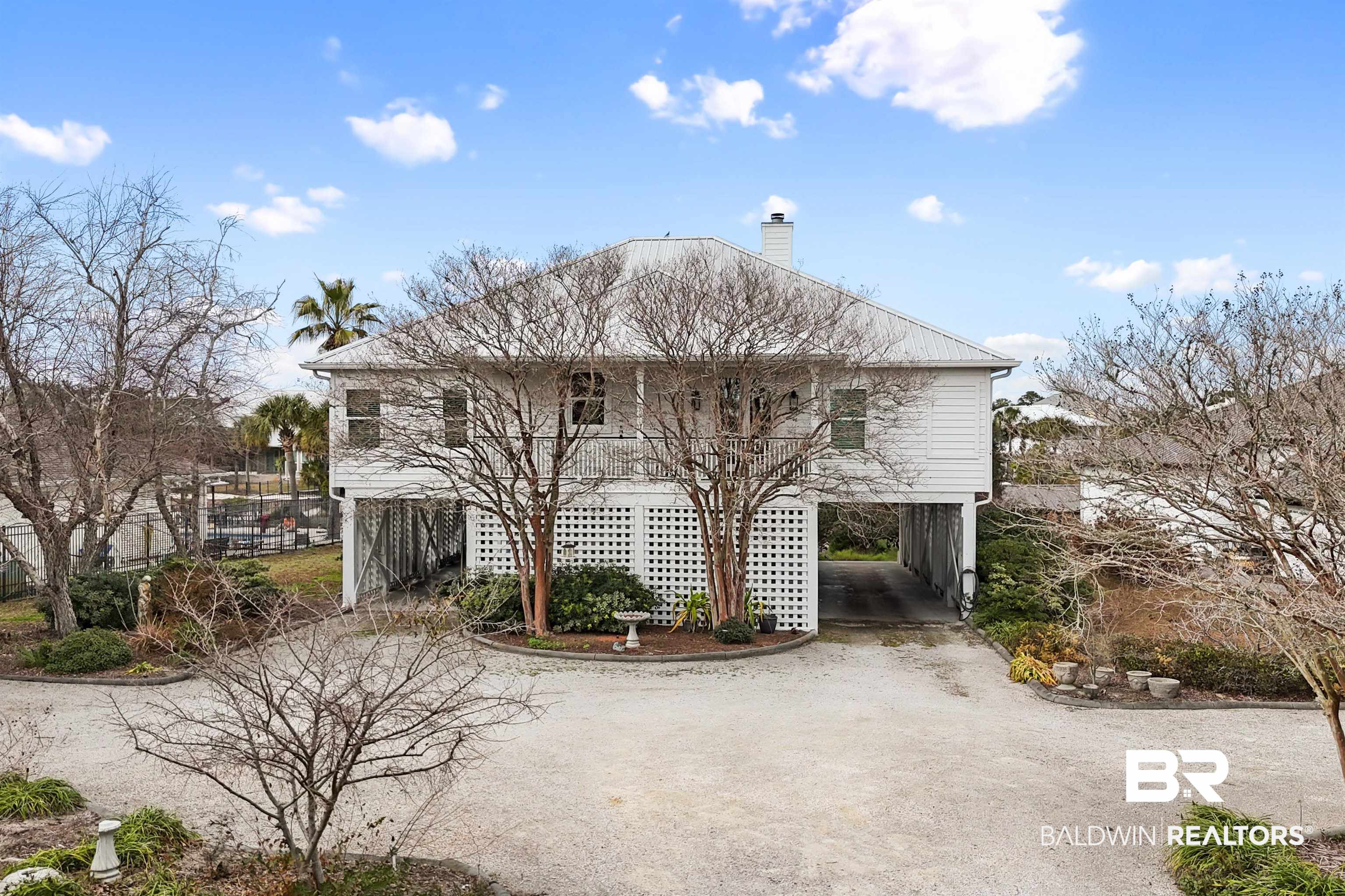 31835 River Road Orange Beach, AL 36561 - Photo 2 of 55 Exterior space with a carport