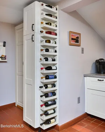 a view of a bedroom with cabinets and wooden floor