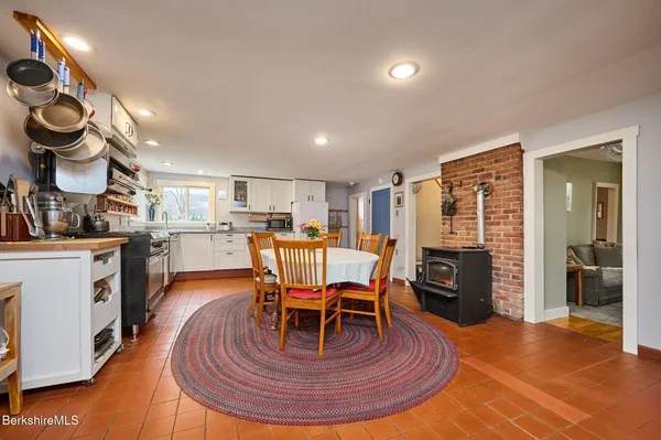 a living room with furniture a dining table and kitchen view
