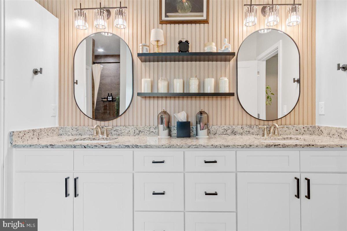 2390 Shirley Road Charles Town, WV 25414 - Photo 32 of 69 a bathroom with double vanity sink and a mirror