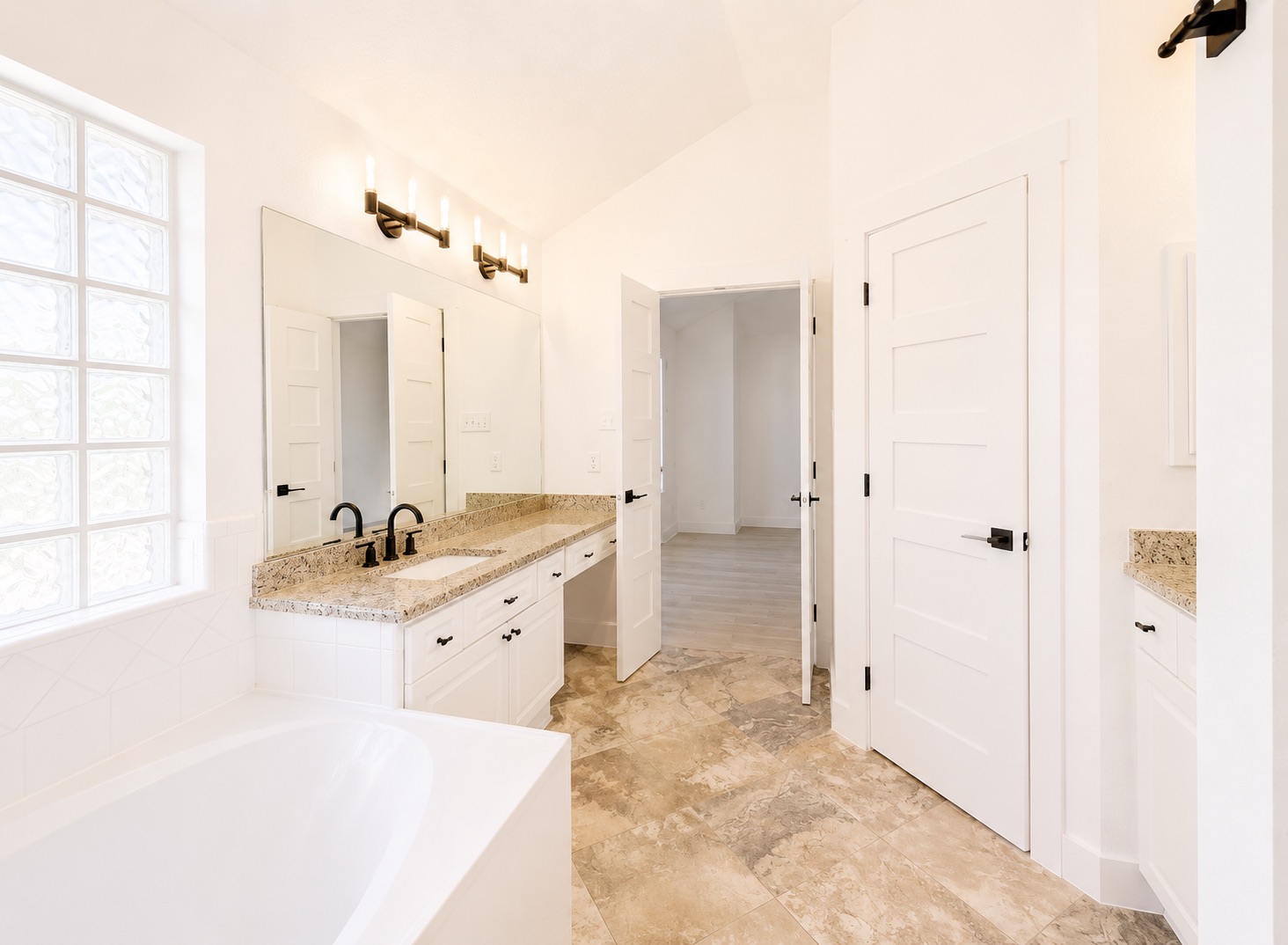 1610 Juniper Ridge Loop Cedar Park, TX 78613 - Photo 16 of 28 Gleaming tile floors complement the stone counters and deep soaking tub in this serene space.