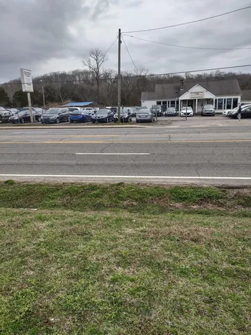 a aerial view of a houses with a yard