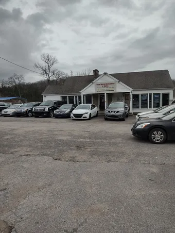a view of a cars park in front of house