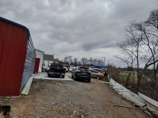 a view of car parked on the street