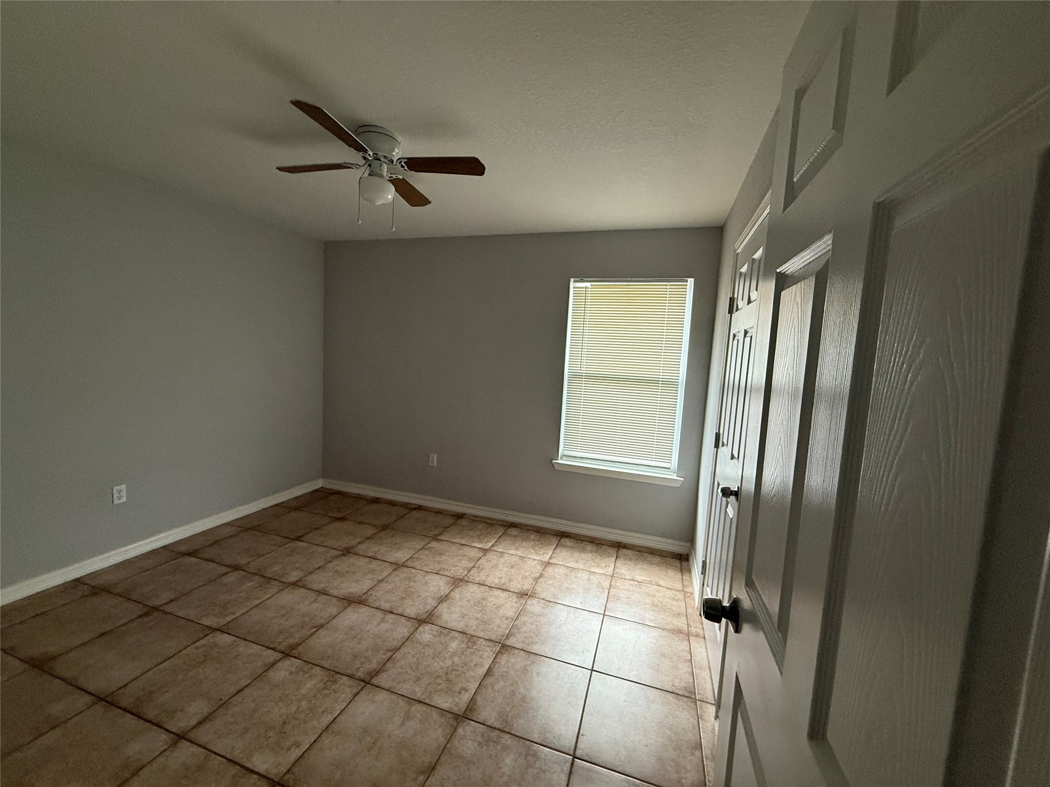 311 Kansas Street Bacliff, TX 77518 - Photo 6 of 12 a view of an empty room and a window