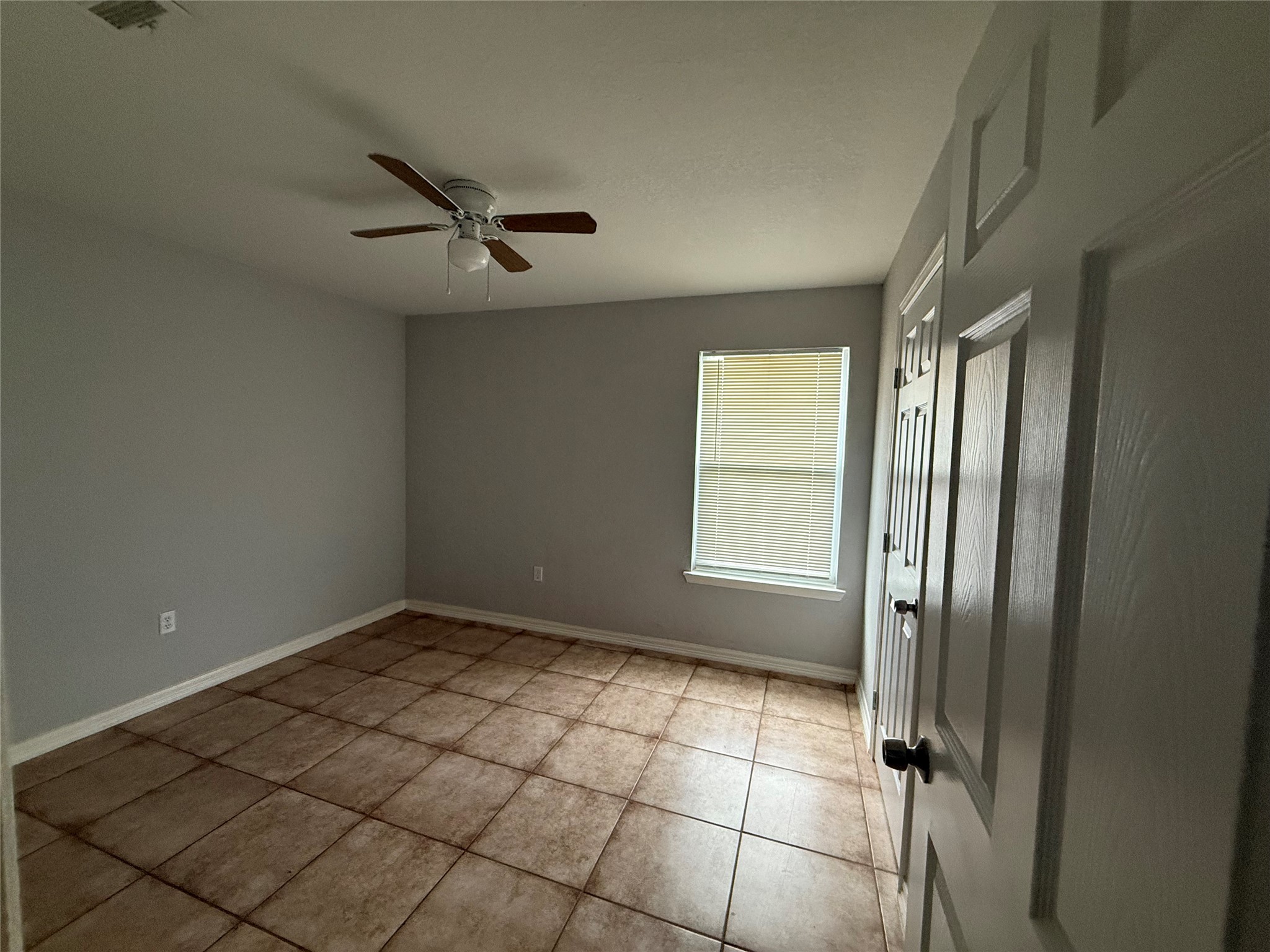 311 Kansas Street Bacliff, TX 77518 - Photo 7 of 12 a view of an empty room and window