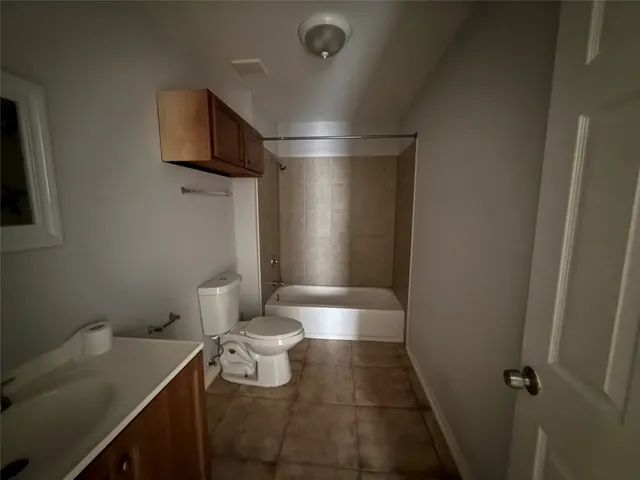 a view of an empty room and a window