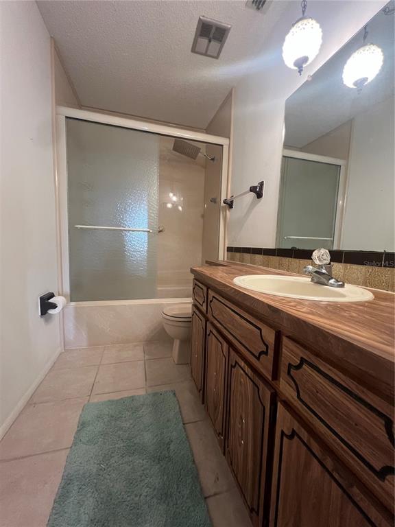 9980 Eagles Point Circle, Unit 3 Port Richey, FL 34668 - Photo 16 of 23 a bathroom with a sink and mirror