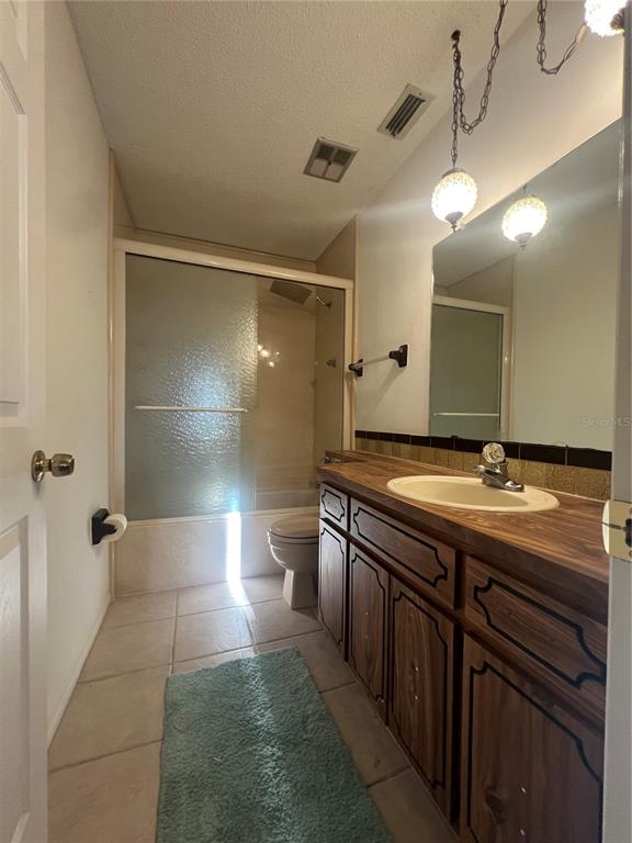 9980 Eagles Point Circle, Unit 3 Port Richey, FL 34668 - Photo 17 of 23 a bathroom with a double vanity sink and mirror