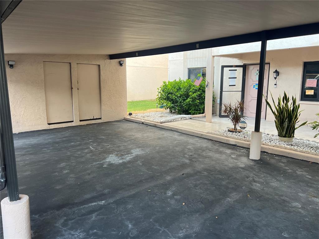 9980 Eagles Point Circle, Unit 3 Port Richey, FL 34668 - Photo 22 of 23 a view of a room with window and palm tree