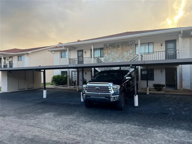 a view of a car park in front of house