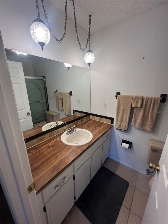 9980 Eagles Point Circle, Unit 3 Port Richey, FL 34668 - Photo 8 of 23 a bathroom with a sink and a mirror