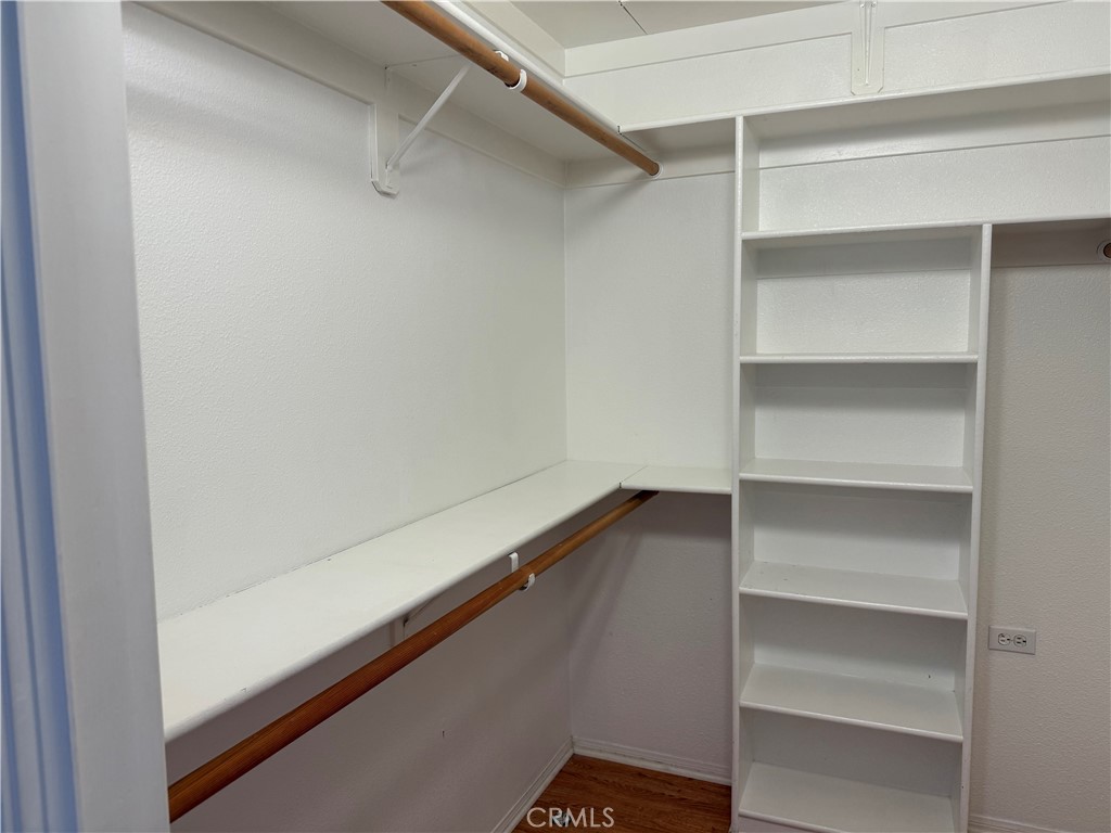1330 Kenwood Rd M7-157f Seal Beach, CA 90740 - Photo 18 of 44 a view of walk in closet with empty racks