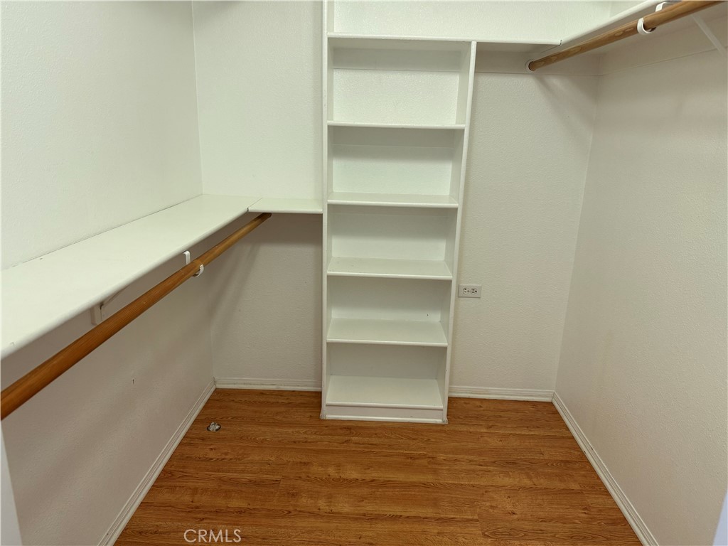 1330 Kenwood Rd M7-157f Seal Beach, CA 90740 - Photo 19 of 44 a view of an empty room with empty room and wooden floor