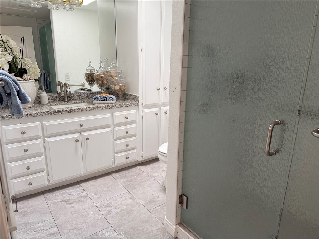 1330 Kenwood Rd M7-157f Seal Beach, CA 90740 - Photo 21 of 44 a bathroom with a granite countertop sink and a mirror