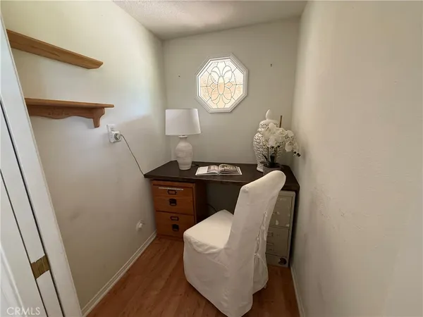 a dining room with furniture and a window