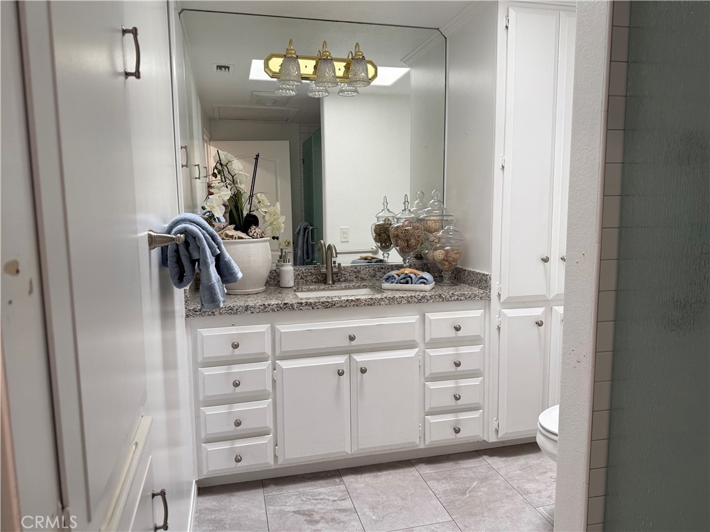 1330 Kenwood Rd M7-157f Seal Beach, CA 90740 - Photo 32 of 44 a bathroom with a sink and a mirror