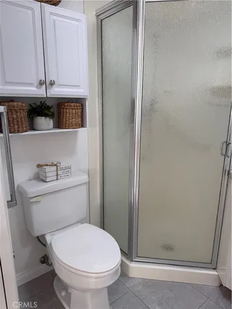 a bathroom with a toilet a sink and a window